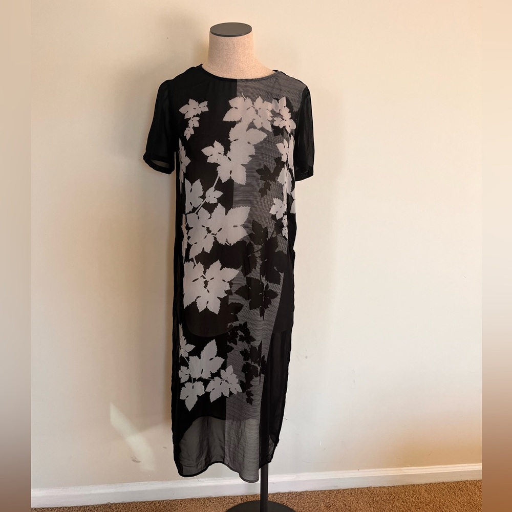 Vince Camuto Black shear with slits on both sides.